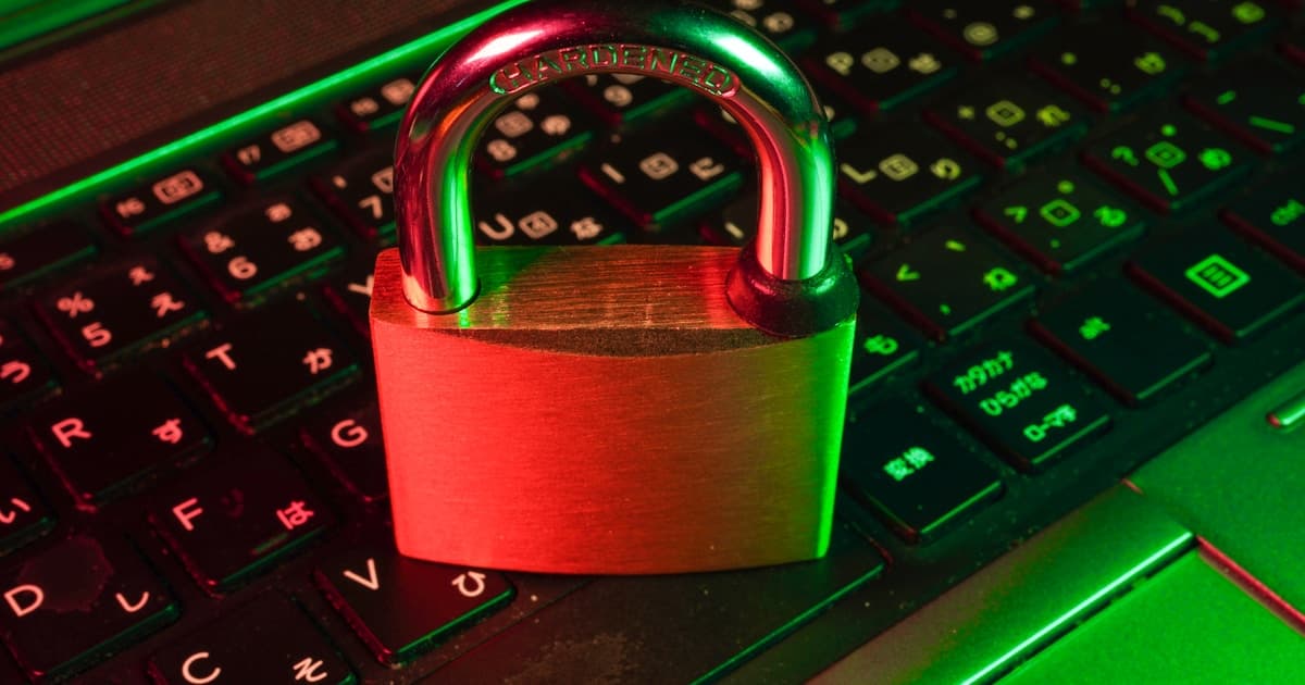 Padlock on a laptop keyboard representing cybersecurity protection